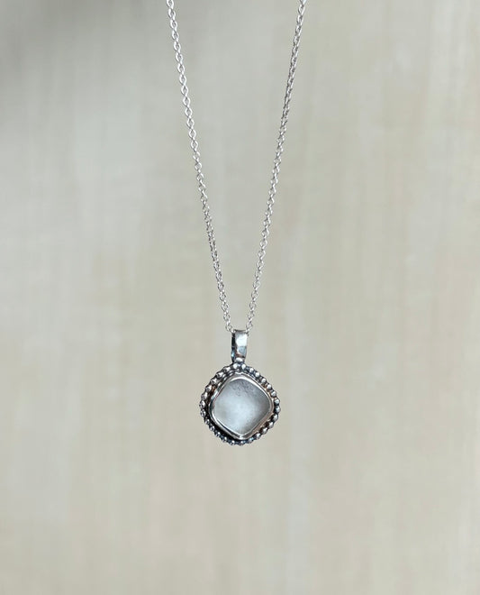 White sea glass necklace made of silver with embellishment