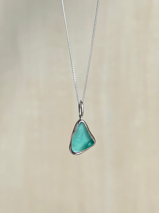 Ice-blue sea glass necklace made of silver
